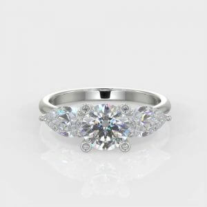 1 x 0.70ct Round Brilliant Cut 2 x 0.25ct Pear Brilliant Cut Diamond Ring